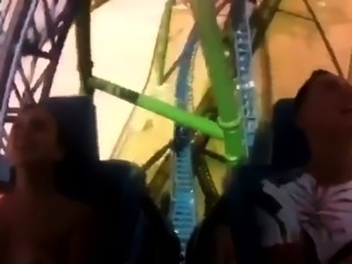Cute amateur teen having fun on a roller coaster ride