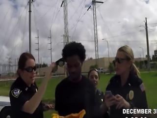 Arrested black male with a big cock slamming two slutty female police 