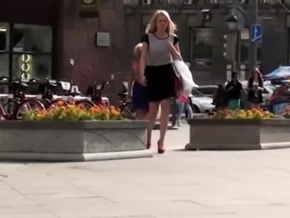 Pantyless European blonde with a tight shaved cunt upskirt